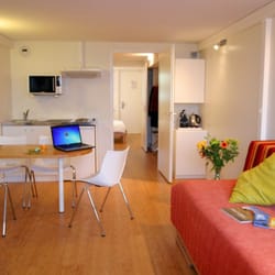 Hôtel Pierre Blanche - Kitchenette; livingroom/sleeper couch, TV, WiFi