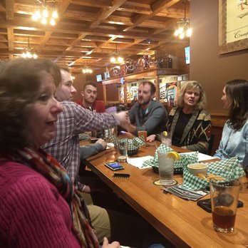 Hoppers Pub - a group of people sitting around a table - Pubs Near Me - Rolla, Missouri