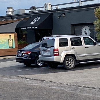 Watershed Kitchen & Bar - two vehicles parked in a parking lot - Cocktail Bars Near Me - Columbus, Ohio
