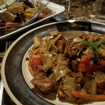 Thai Square - Pad kee mow with tofu, spicy eggplant with tofu in back - Thai Near Me - Denton, Texas Thai Square - Pad kee mow with tofu, spicy eggplant with tofu in back - Thai Near Me - Denton, Texas