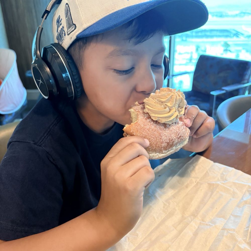 Donutique - My sweetie, enjoying his churro doughnut - Coffee & Tea Near Me - Las Vegas, Nevada Donutique - My sweetie, enjoying his churro doughnut - Coffee & Tea Near Me - Las Vegas, Nevada