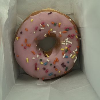 Dunkin' -  a pink frosted donut with sprinkles - Donuts Near Me - Gainesville, Florida