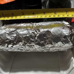 Almost an 8 inch regular burrito they have another larger one too. Almost an 8 inch regular burrito they have another larger one too.