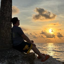 My husband enjoying the magic of Sunset Beach
