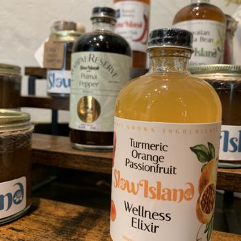 Slow Island Provisions - Sales floor display showcases some of their freshly bottled Elixirs and Sauces. - Specialty Food Near Me - Lihue, Hawaii Slow Island Provisions - Sales floor display showcases some of their freshly bottled Elixirs and Sauces. - Specialty Food Near Me - Lihue, Hawaii