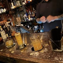 46 A Speakeasy - The "sampling bar" where you take a straw on the right, grab your taste and discard the straw on the left.