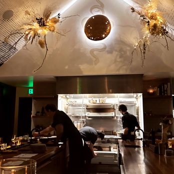 Beckon - a restaurant kitchen with a candle lit area - New American Near Me - Denver, Colorado
