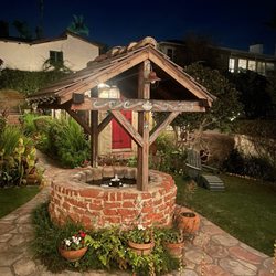 Manzanita Cottages of Laguna Beach - Wishing well at night.