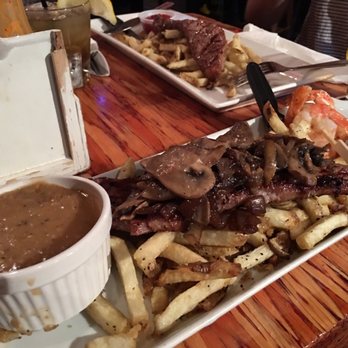 Elwoods - Streak and fries with mushrooms, prawns and gravy - Pubs Near Me - Vancouver, British Columbia Elwoods - Streak and fries with mushrooms, prawns and gravy - Pubs Near Me - Vancouver, British Columbia