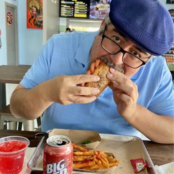 Barrio Dogg - Enjoying El Capone with a side of fries and a Big Red. - Hot Dogs Near Me - San Antonio, Texas