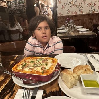 Rubirosa - Lasagna for two, the included focaccia bread and oil - Italian Near Me - New York, New York Rubirosa - Lasagna for two, the included focaccia bread and oil - Italian Near Me - New York, New York