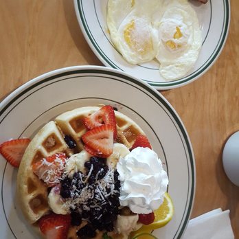 Woody's Diner - Waffle comblo - 2 eggs, bacon, Belgian waffle, strawberries, banana, blueberries, and whipped creme. - American Near Me - Orange, California Woody's Diner - Waffle comblo - 2 eggs, bacon, Belgian waffle, strawberries, banana, blueberries, and whipped creme. - American Near Me - Orange, California