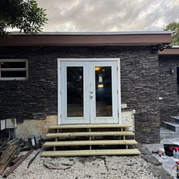 Exterior outside entrance of Alex Home Service - Working with a tree Exterior outside entrance of Alex Home Service - Working with a tree