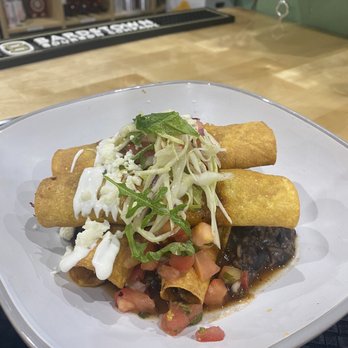 Foko - Toquitos with chicken and dirty rice - Breakfast & Brunch Near Me - Louisville, Kentucky Foko - Toquitos with chicken and dirty rice - Breakfast & Brunch Near Me - Louisville, Kentucky