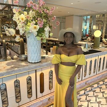 Miss River Restaurant - a woman standing in a yellow dress - Desserts Near Me - New Orleans, Louisiana Miss River Restaurant - a woman standing in a yellow dress - Desserts Near Me - New Orleans, Louisiana