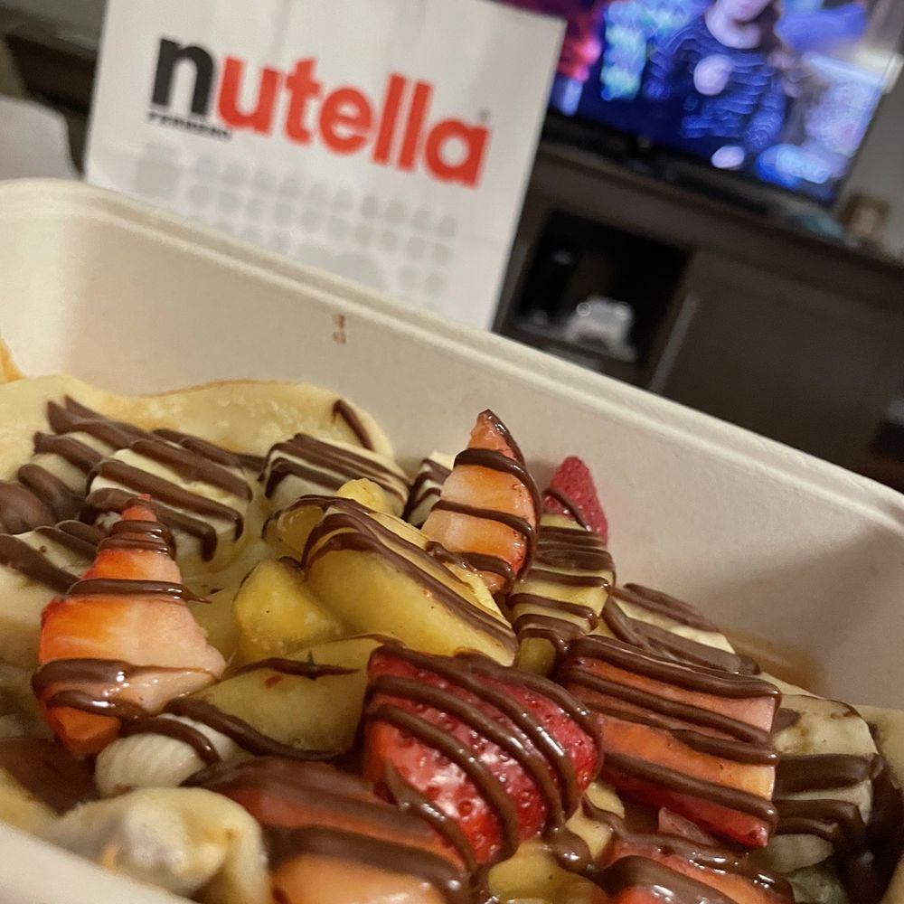 Nutella Cafe - Crepe with caramelizad apples, bananas and strawberries. - Desserts Near Me - Chicago, Illinois Nutella Cafe - Crepe with caramelizad apples, bananas and strawberries. - Desserts Near Me - Chicago, Illinois