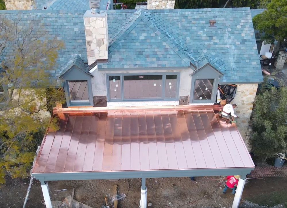 Slide of Honey Badger Roofing