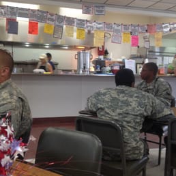a group of soldiers sitting at a table a group of soldiers sitting at a table