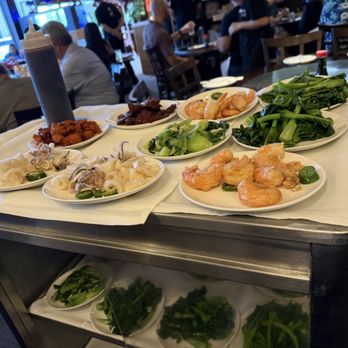 Tropical Chinese Restaurant - Vegetable rolling cart with some seafood dishes. - Dim Sum Near Me - Miami, Florida Tropical Chinese Restaurant - Vegetable rolling cart with some seafood dishes. - Dim Sum Near Me - Miami, Florida