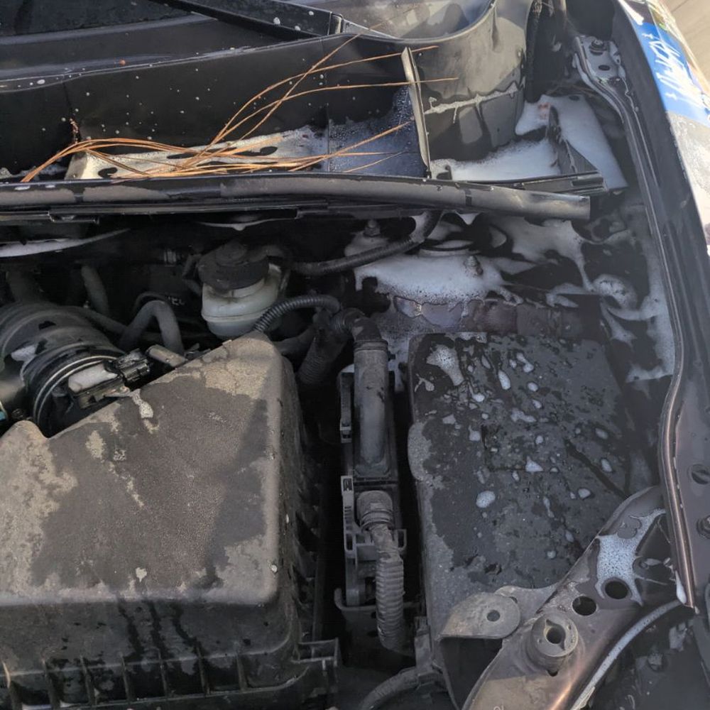 Soapy water under hood on battery Soapy water under hood on battery