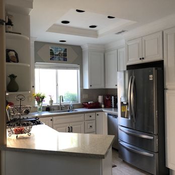 Regency Custom Kitchens - a kitchen with stainless steel appliances - General Contractors Near Me Regency Custom Kitchens - a kitchen with stainless steel appliances - General Contractors Near Me
