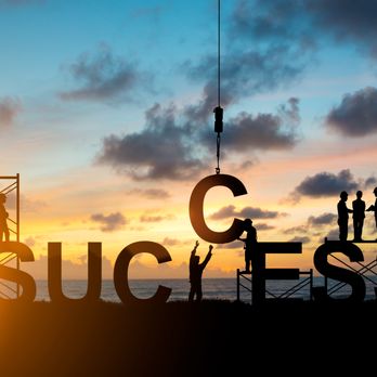 KMC Construction - silhouettes of people standing in front of a sign that says success - General Contractors Near Me KMC Construction - silhouettes of people standing in front of a sign that says success - General Contractors Near Me