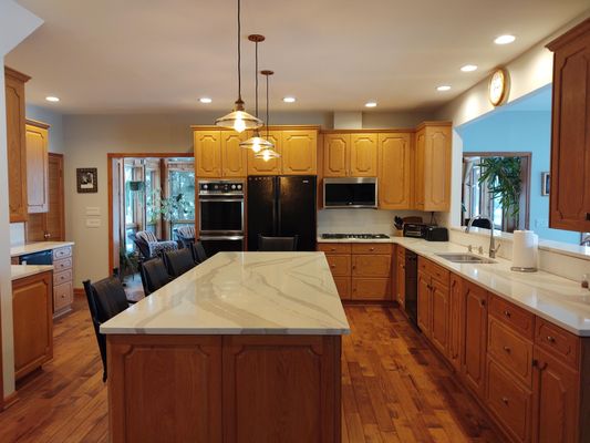 Solomon Kitchen renovation - Added new countertops and backsplash to this dark and dated lake home.
