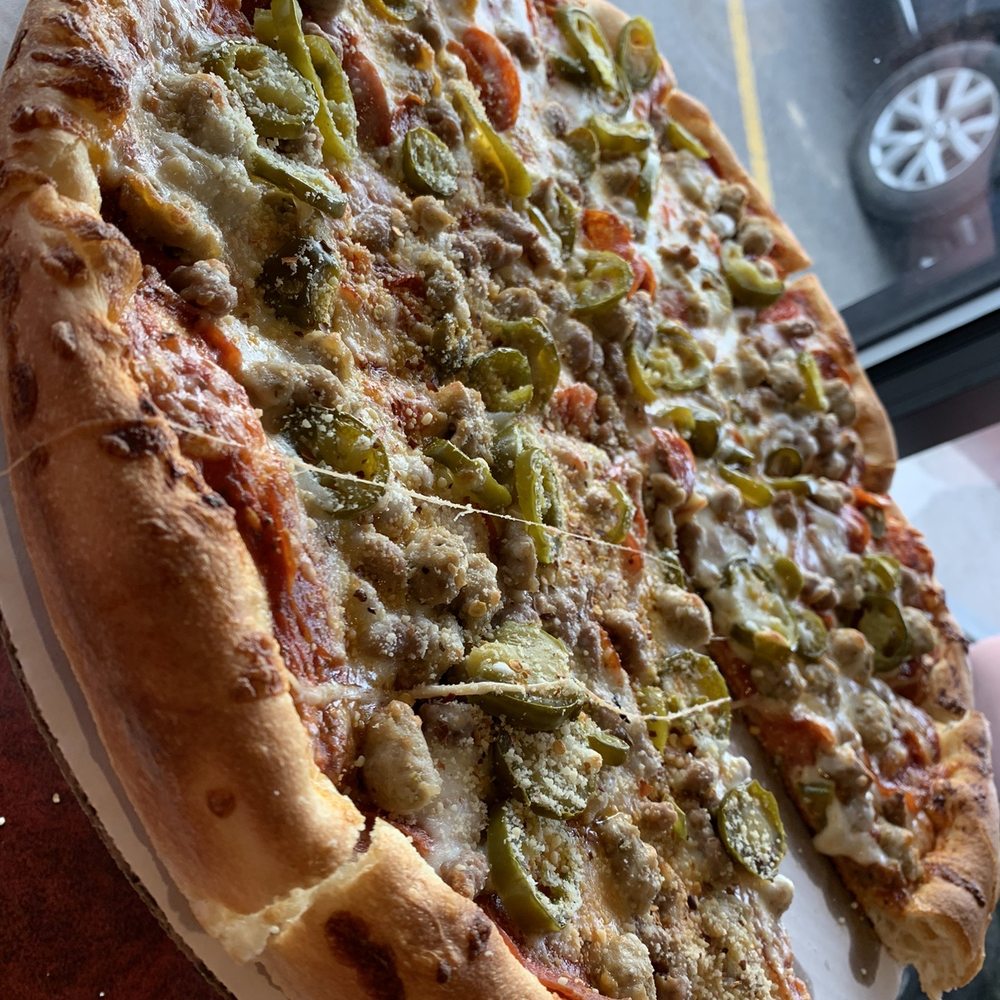 Hungry Bear Restaurant - Meat Lover's Pizza with added jalapeños. - Pizza Near Me - Cody, Wyoming Hungry Bear Restaurant - Meat Lover's Pizza with added jalapeños. - Pizza Near Me - Cody, Wyoming