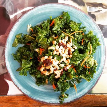 Karma Road - Kale salad, massaged with avocado (no avocado slices in the salad, though), topped with raisins and cashews. - Vegetarian Near Me - New Paltz, New York Karma Road - Kale salad, massaged with avocado (no avocado slices in the salad, though), topped with raisins and cashews. - Vegetarian Near Me - New Paltz, New York
