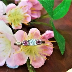Molly's Jewelry Design - 14 Karat White Gold Three Stone Style Ring with Brilliant Round Cut Diamond Center And A Genuine Pink Tourmaline On Each Side