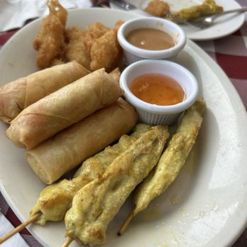 Bainbridge Thai Cuisine - Appetizer combo ( Spring Roll (4) And (8) Crispy Calamari and Chicken Satay) - Thai Near Me - Bainbridge Island, Washington Bainbridge Thai Cuisine - Appetizer combo ( Spring Roll (4) And (8) Crispy Calamari and Chicken Satay) - Thai Near Me - Bainbridge Island, Washington