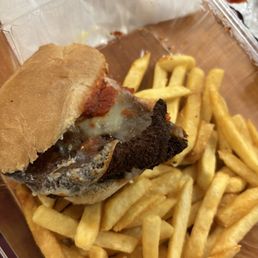 Chicken parm sandwich and fries Chicken parm sandwich and fries