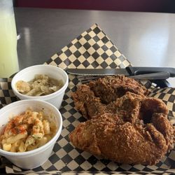 Momma C's Soul Food Kitchen - 2 crispy fried chicken breasts (well seasoned and juicy) Mac n cheese and cabbage.