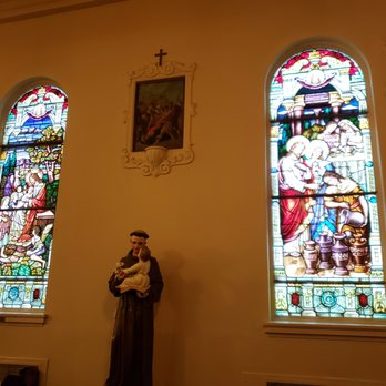 St Emydius Church - Stained glass and statue just to the right of the entrance. - Churches Near Me - San Francisco, California