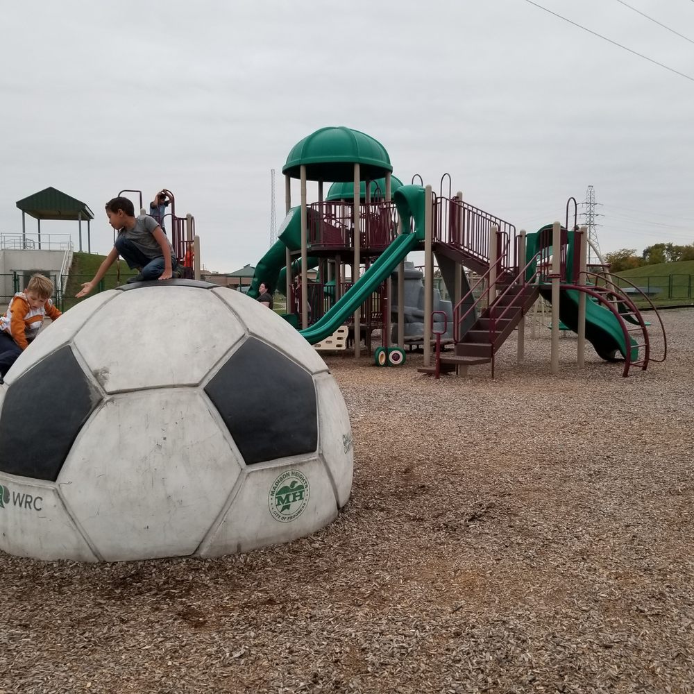 Red Oaks County Park - 2020-10-11 Red Oaks Playground. Madison Heights, MI. The centerpiece has to be the giant buried soccer ball! - Parks Near Me - Madison Heights, Michigan Red Oaks County Park - 2020-10-11 Red Oaks Playground. Madison Heights, MI. The centerpiece has to be the giant buried soccer ball! - Parks Near Me - Madison Heights, Michigan
