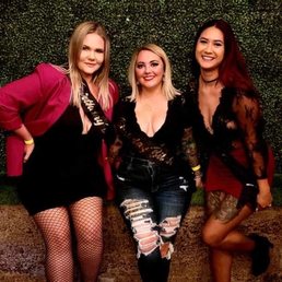 three women posing for a picture three women posing for a picture