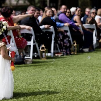 Harmonious Events - Flower girl walking down the isle - Wedding Planning Near Me