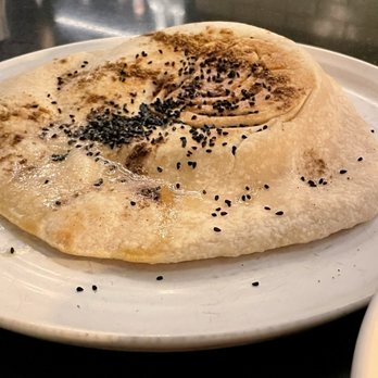 The Dearborn - Housemade pita on The Dearborn Meze Plate - New American Near Me - Chicago, Illinois The Dearborn - Housemade pita on The Dearborn Meze Plate - New American Near Me - Chicago, Illinois