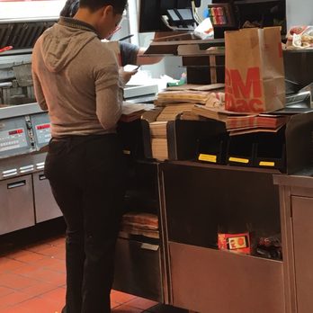 McDonald's - That employee in the grey sweater is supposed to be filling dine in orders, but she's on her phone instead. - Burgers Near Me - Deltona, Florida