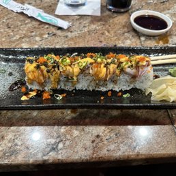 Corey Roll (Spicy Salmon, Spicy tuna, Avocado inside, tuna, salmon on top, seared with chefs special sauce. Corey Roll (Spicy Salmon, Spicy tuna, Avocado inside, tuna, salmon on top, seared with chefs special sauce.