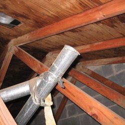 Sure Sight Home Inspection - Exhaust vent detached and discharging into the attic.
