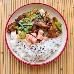 Mian - Fresh pork leg, twice-cooked in traditional Sichuan style with locally grown garlic shoots.Served over steamed rice with crisp, tangy pickle