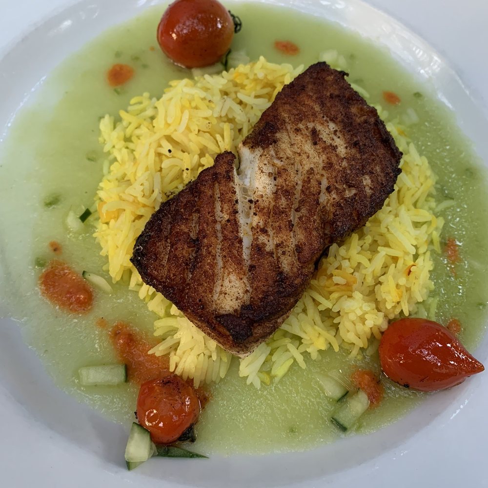 Winds Cafe - Seared Halibut with Spanish Spices and Gazpacho Sauce - American Near Me - Yellow Springs, Ohio Winds Cafe - Seared Halibut with Spanish Spices and Gazpacho Sauce - American Near Me - Yellow Springs, Ohio