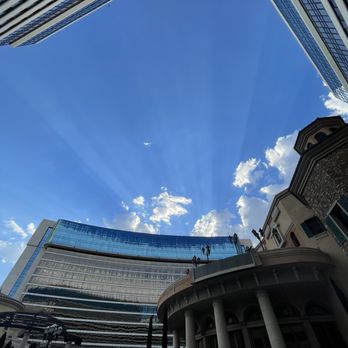 Peppermill Reno - The pool area looking up at the beautiful sun shining just below the Tuscany tower - Casinos Near Me - Reno, Nevada Peppermill Reno - The pool area looking up at the beautiful sun shining just below the Tuscany tower - Casinos Near Me - Reno, Nevada
