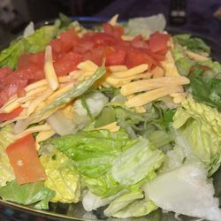 This was my "taco salad". Missing the chili and chips... the tomatoes aren't even part of it!