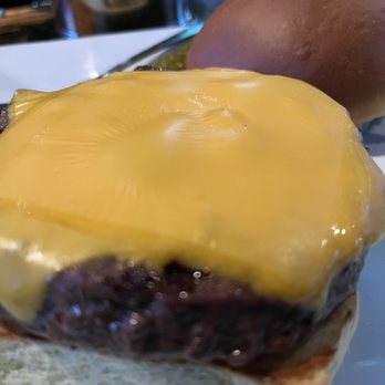The Inn - a cheeseburger and a potato on a plate - American Near Me - Long Beach, New York The Inn - a cheeseburger and a potato on a plate - American Near Me - Long Beach, New York