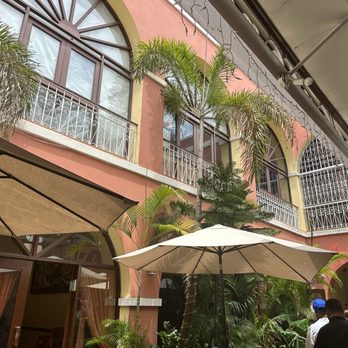 Barrachina - Interior of the open area featuring umbrella covered tables. - Seafood Near Me - San Juan, Puerto Rico Barrachina - Interior of the open area featuring umbrella covered tables. - Seafood Near Me - San Juan, Puerto Rico