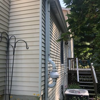 Radon Man - Radon fan placed near gutter spout to blend in. - Home Inspectors Near Me - Grand Rapids, Michigan Radon Man - Radon fan placed near gutter spout to blend in. - Home Inspectors Near Me - Grand Rapids, Michigan