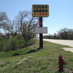 Cedar Inn 4 Less - Sign on I-34.