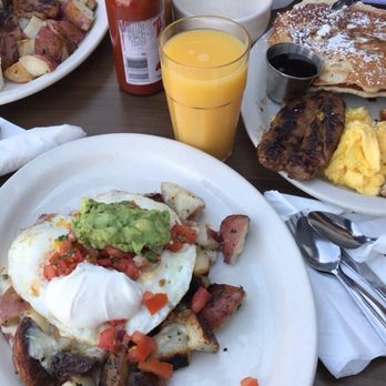 Millie's Cafe - Eleanore R Special! Two over easy eggs over a bed of potatoes, topped with guacamole, sour cream, and pico de gallo! - Breakfast & Brunch Near Me - Los Angeles, California Millie's Cafe - Eleanore R Special! Two over easy eggs over a bed of potatoes, topped with guacamole, sour cream, and pico de gallo! - Breakfast & Brunch Near Me - Los Angeles, California